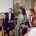 Group of multiethnic people sitting in circle in office interior and listening to mentor sharing his experience, values and leadership mindset.